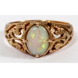 14KT YELLOW GOLD & OPAL LADY'S RING, SIZE 6.25: A 14kt yellow gold lady's ring, featuring a center