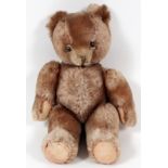 STUFFED TEDDY BEAR, H 14": glass eyes, stitched nose, pad feet, brown fur.