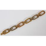 18KT GOLD WOVEN LINK BRACELET, L 7 3/4": A lady's tri colored 18kt gold bracelet, in a woven link