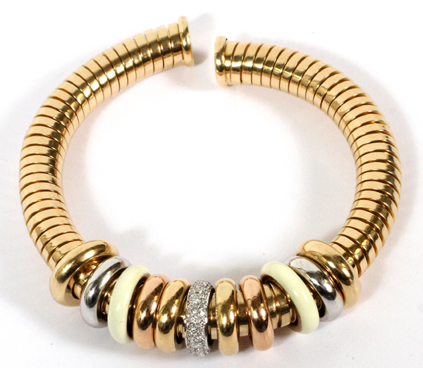 0.65CT DIAMOND & 18KT GOLD ROLLING RING BRACELET: An 18kt gold lady's bangle bracelet, featuring - Image 2 of 2