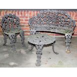 CAST IRON GARDEN FURNITURE, THREE PIECES: Including 1 bench, 1 chair, and 1 round table.