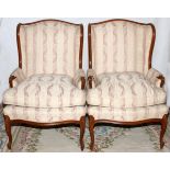 FRENCH STYLE BERGERES, PAIR: Mahogany frames with upholstered backs, padded arms and loose seat