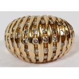 14KT YELLOW GOLD & DIAMOND RING: A domed 14kt yellow gold ring bead set with enhancement diamonds,