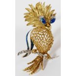 18 KT GOLD, ENAMEL AND DIAMOND BIRD ON PERCH PIN: depicts a Phoenix bird with filigree body,