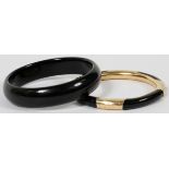 14KT YELLOW GOLD & POLISHED BLACK STONE BANGLE BRACELETS, TWO: Including 1 polished black stone