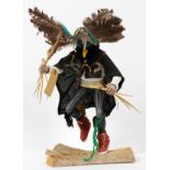 NATIVE AMERICAN, KACHINA 'CROW' DOLL, C. 1985, H 21", W 11": Carved wood doll, depicted in a dancing