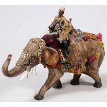 COMPOSITION FIGURE OF A MOOR RIDING AN ELEPHANT, H 21 1/2", L 28": Adorned with trappings.