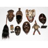 AFRICAN TRIBAL CARVED WOOD MASKS & FIGURES, 20TH C., SIX, L 4"-12": Including six masks, one dual