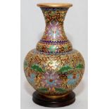 CHINESE ENAMELED BRASS VASE, H 8": Enameled pink and blue flowers on a gilt ground among blue,