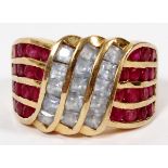 14KT YELLOW GOLD, RUBY & AQUAMARINE RING: With a center blue stones 15 flanked by 30 pink sapphire.