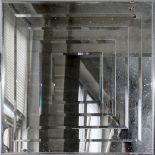 CONTEMPORARY BEVELED GLASS MIRROR, H 24", W 24": In a simple metal frame.