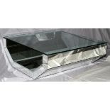 MODERN MIRRORED GLASS TOP COFFEE TABLE, H 16" L 42": Raised on a faceted mirrored open base, with