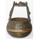 PAINTED & WOVEN SPLINT BASKET, H 24" W 16": Having a twisted branch handle.