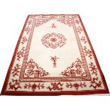 CHINESE PEKING DESIGN WOOL RUG, W 5' 6" L 8' 6": Having a center medallion on a cream ground, with