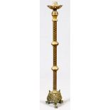 ECCLESIASTICAL BRASS CANDLE STAND, H 56": Raised on a pierced, tri-footed base. Decorated in a