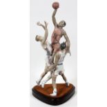 LLADRO PORCELAIN FIGURE GROUP, 'TO THE RIM', H 25 1/2", #1800: A group of three basketball