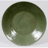 CHINESE CELADON CHARGER, C. 1800, DIA 16": Incised motif of clouds, flowers and lines. Unglazed foot
