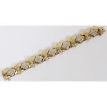18 KT WHITE AND YELLOW GOLD AND PAVE DIAMOND  LINK BRACELET L 7", DIA 2 3/8" X 1 7/8" I. D.:  having