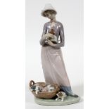 LLADRO PORCELAIN FIGURE, 'GIRL WITH PUPPIES', H  8 3/4", #5807: Number 5807.