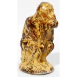 MOTTLED YELLOW WARE POTTERY SEATED MONKEY BANK  19TH C. H 5":  In the form of a monkey seated on