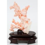 CHINESE CARVED CORAL FIGURE OF GUANYIN, H 5":   White to pink in color, depicted with teapot and