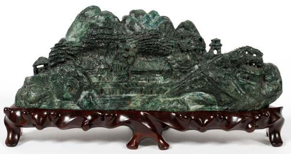 CHINESE FUCHSITE CARVING OF A VILLAGE, H 4", L  10":  Raised on a wood base.