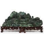 CHINESE FUCHSITE CARVING OF A VILLAGE, H 4", L  10":  Raised on a wood base.