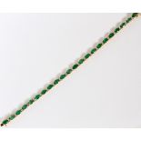 9.00CT EMERALDS & 1.11CT DIAMONDS 14KT YELLOW  GOLD BRACELET, L 7 1/2":  A 9.00ct natural