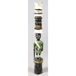 AFRICAN WOODEN TOTEM POLE, H 64":  Male form  totem in a green shirt.  Having painted green,