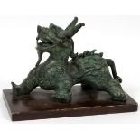 CHINESE STYLE PATINATED BRONZE FU DOG FOR  FREDERICK COOPER, H 7", L 10 1/2":  Mounted on a  wood