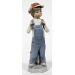 LLADRO PORCELAIN FIGURINE, H 8 3/4", BOY WITH  OVERALLS: