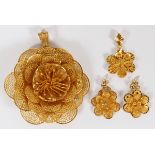 14KT YELLOW GOLD FLORAL JEWELRY SUITE, FOUR  PIECES:  Floral pendant groupings. 4 pieces:   gold