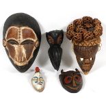 AFRICAN & INDONESIAN CARVED MASKS, FIVE, H  10"-16":  Including one decorated at the top  with woven