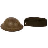 WW I "DOUGHBOY" HELMET:  A WW I Doughboy helmet  with original liner and chin strap. Accompanied  by