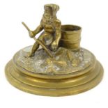 Victorian brass match stand modelled as a fisherman, the base 13cm round : FOR CONDITION REPORTS AND