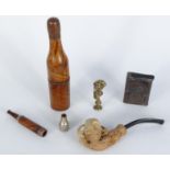 Assorted objects comprising a brass Punch pipe tamper, oriental metal vesta case , champagne