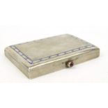Continental silver cigarette box with engine turned decoration, the lid with blue enamel decoration,