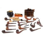 Large collection of pipes including briar examples, together with a pipe stand and tobacco jar : FOR