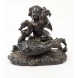 Victorian bronze model of a cherub riding a swan, 13cm high : FOR CONDITION REPORTS AND TO BID