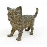 Cold painted bronze model of a cat, stamped Geschutzt to leg, 18cm long : FOR CONDITION REPORTS