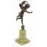 Bronze model of Cupid on a green marble base, 18cm high : FOR CONDITION REPORTS AND TO BID LIVE