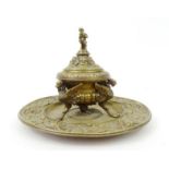 Victorian bronze inkwell, decorated with griffins, on a Bacchus ram's head base, stamped 'APC'