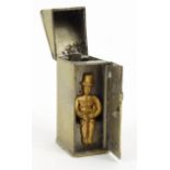 Novelty brass vesta in the form of a gentleman in an outhouse toliet, 5cm high : FOR CONDITION