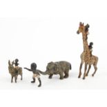 Novelty cold painted bronze elephant -the trunk holding aloft a black boy, black boys climbing up