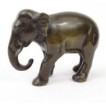 Bronze model of an elephant, 8cm high : FOR CONDITION REPORTS AND TO BID LIVE VISIT WWW.