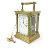 Brass mantel clock with column supports - R & Co, Made in Paris, striking on a gong, 12cm high