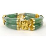 Oriental Chinese green jade bangle with gilt metal mounts : For Condition Reports please visit www.