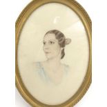 Oval framed portrait of a young lady with diamond drop earrings in a gilt frame, 54cm x 38cm