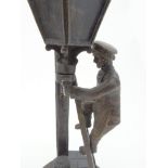 Pair of Russian patinated bronze figures of street lamp lighters, each signed to the base, 23cm high