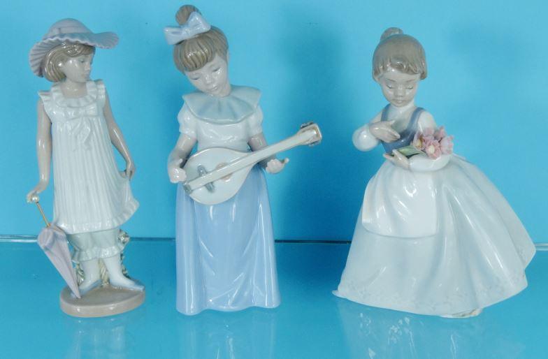 Two boxed Lladro China figures and a boxed Nao figure : For Condition Reports please visit www.